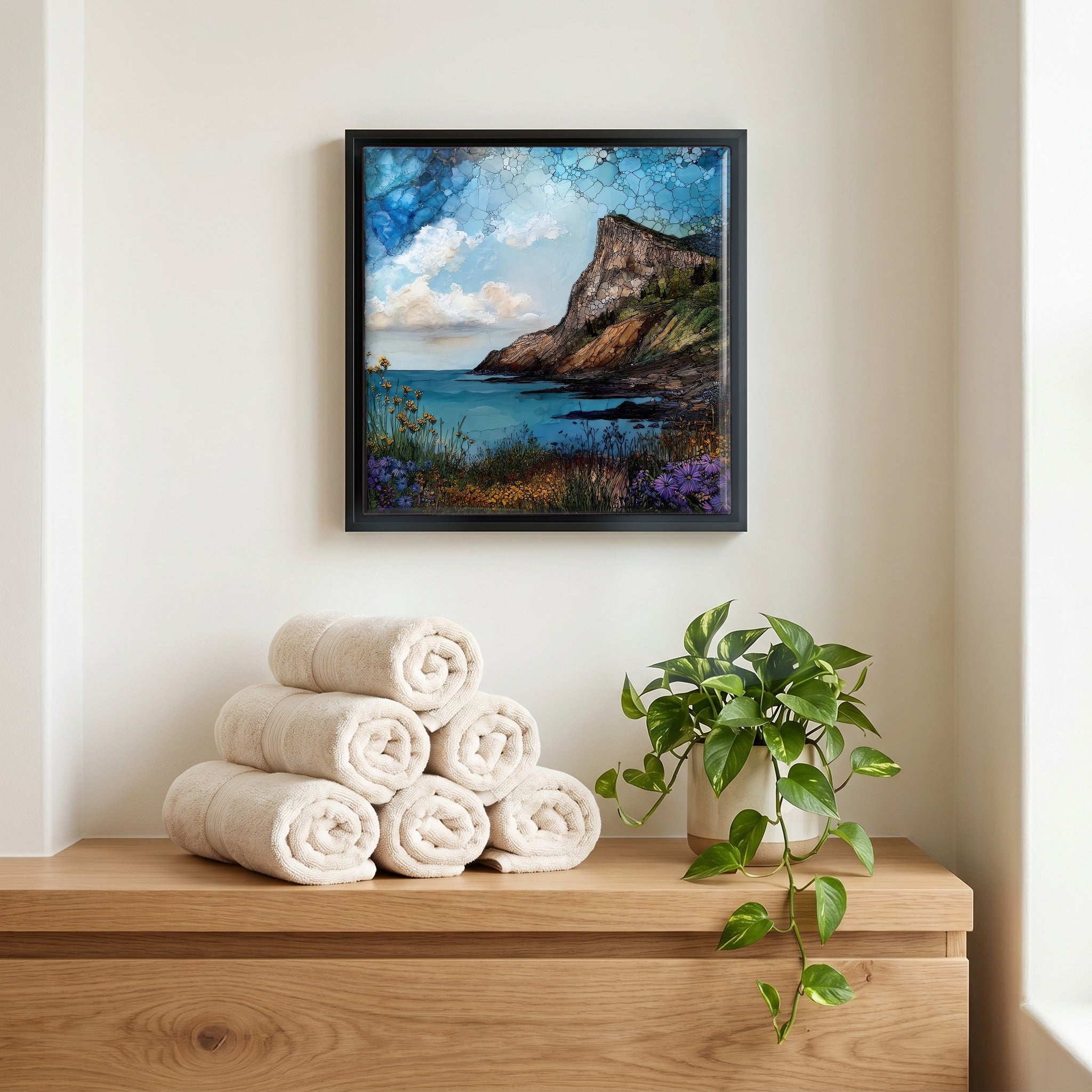 Above the linens, in a slim black surround.