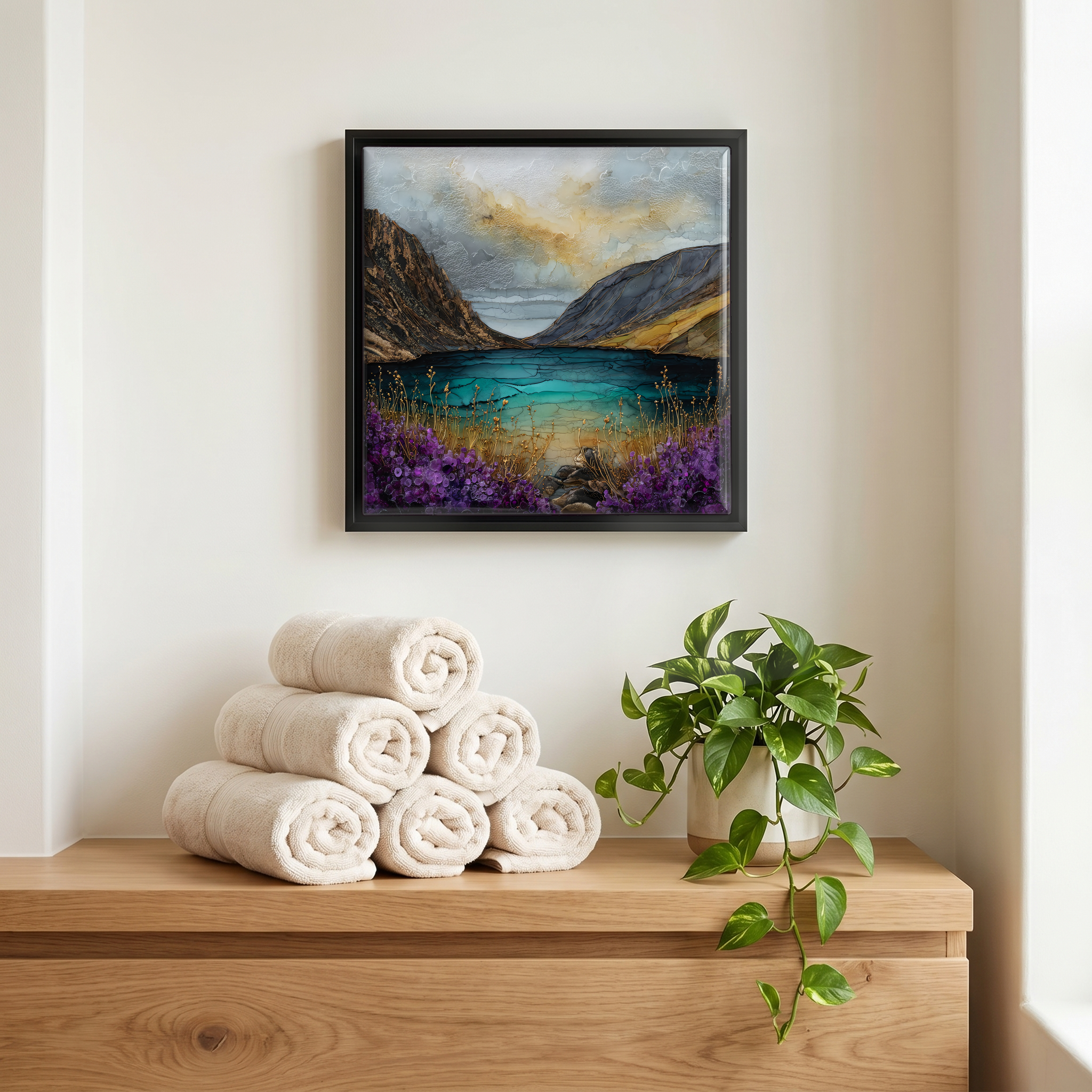 Above the linens, in a slim black surround.