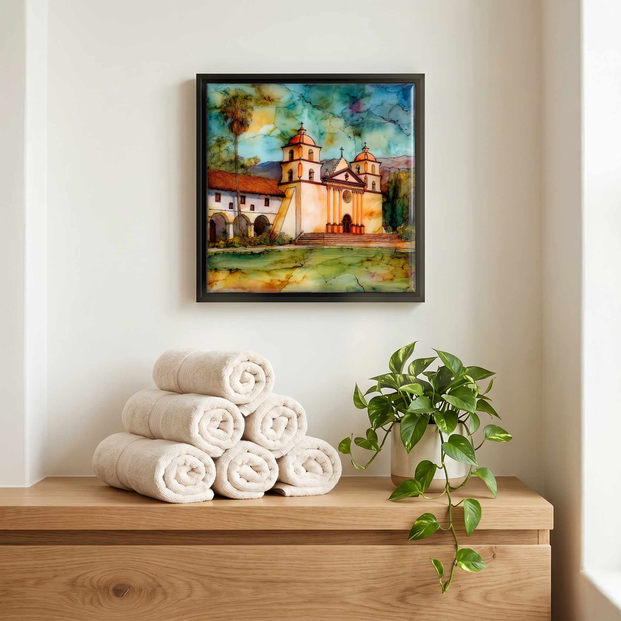 Above the linens, in a slim black surround.