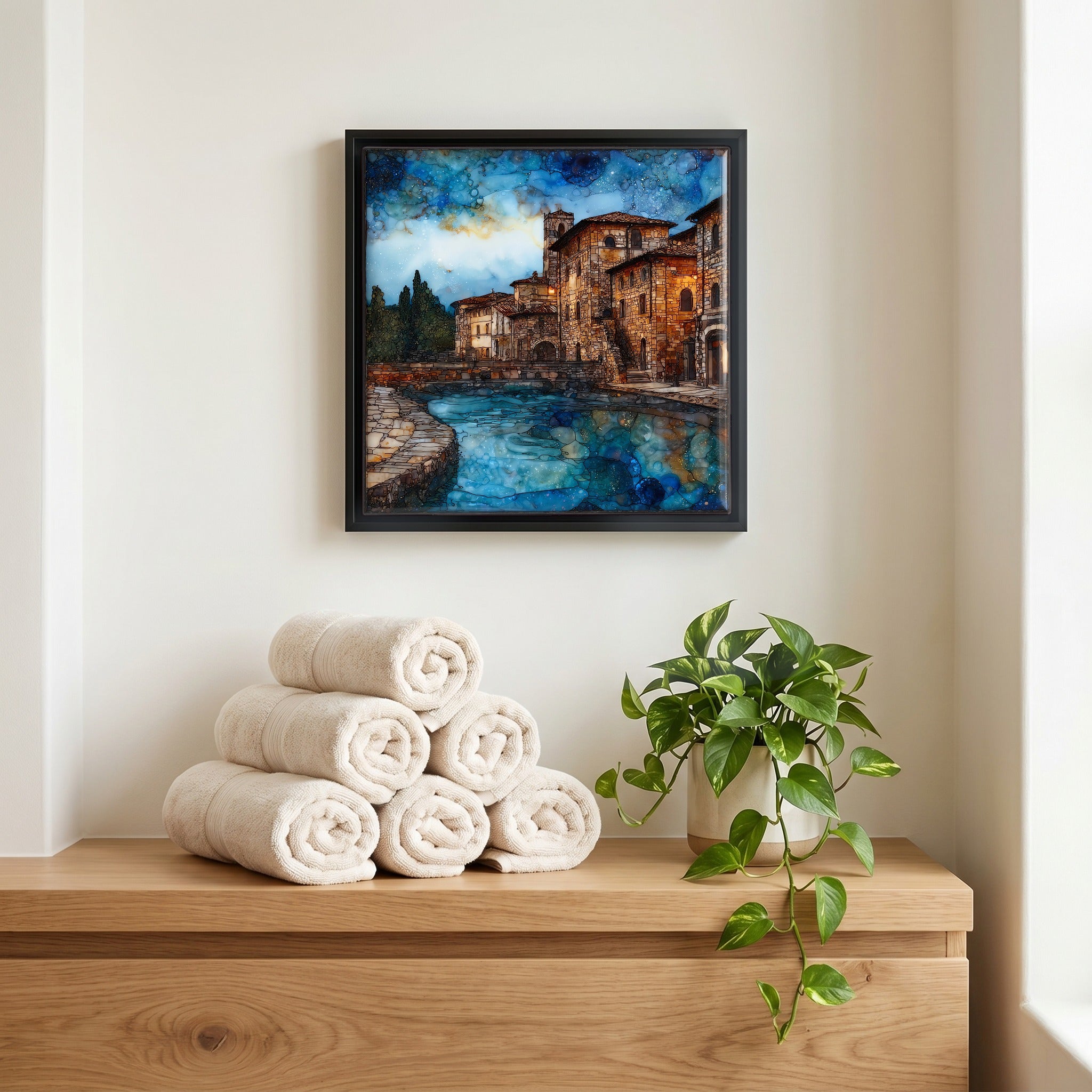 Above the linens, in a slim black surround.