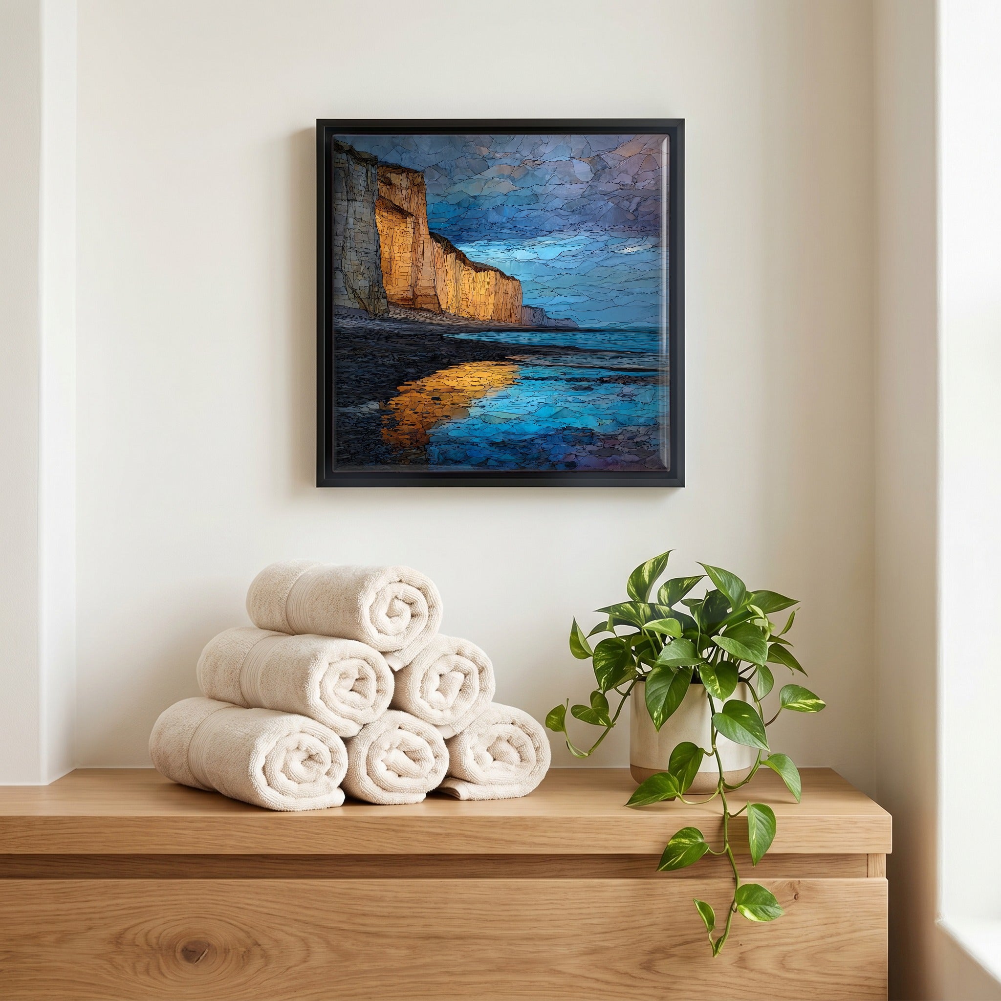 Above the linens, in a slim black surround.