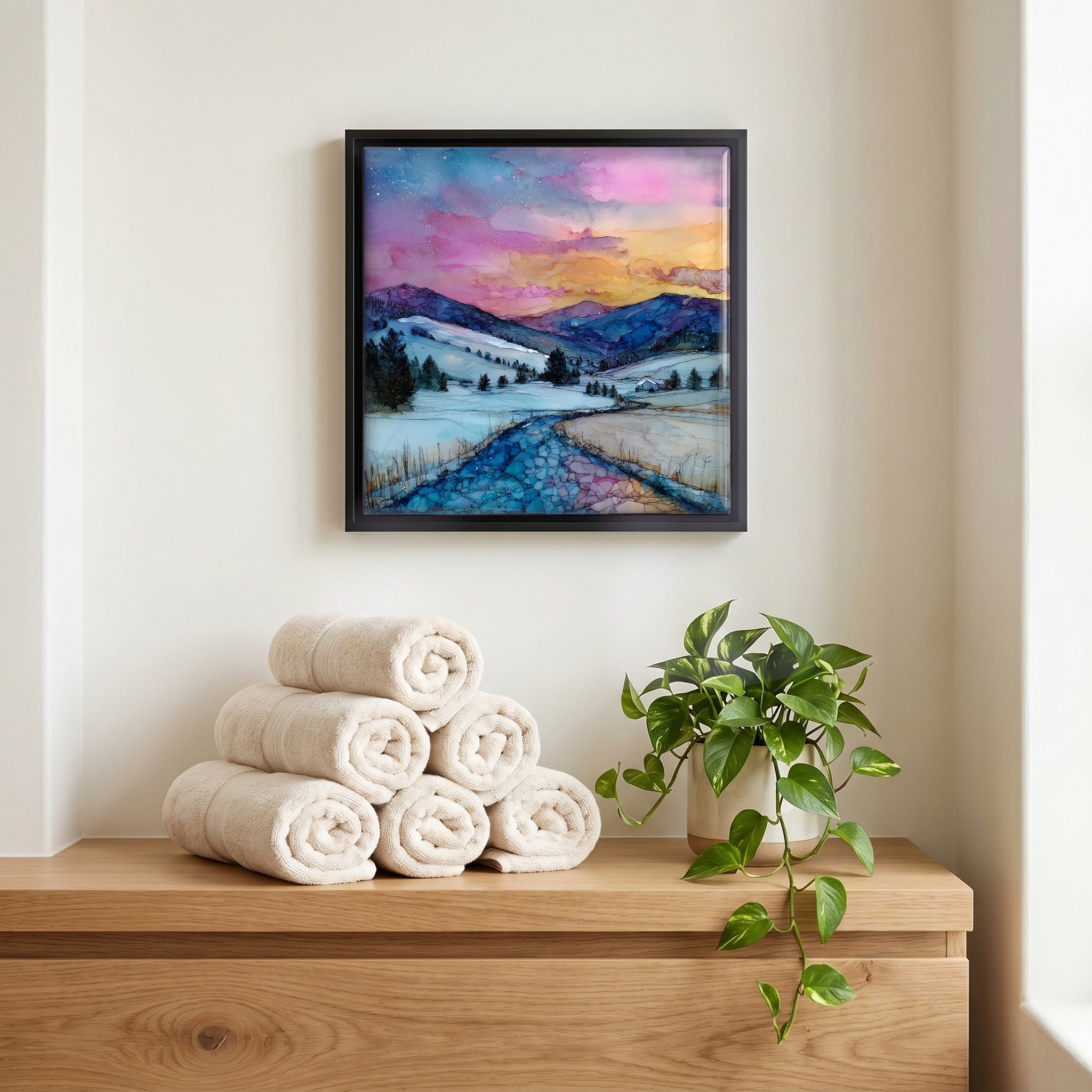 Above the linens, in a slim black surround.