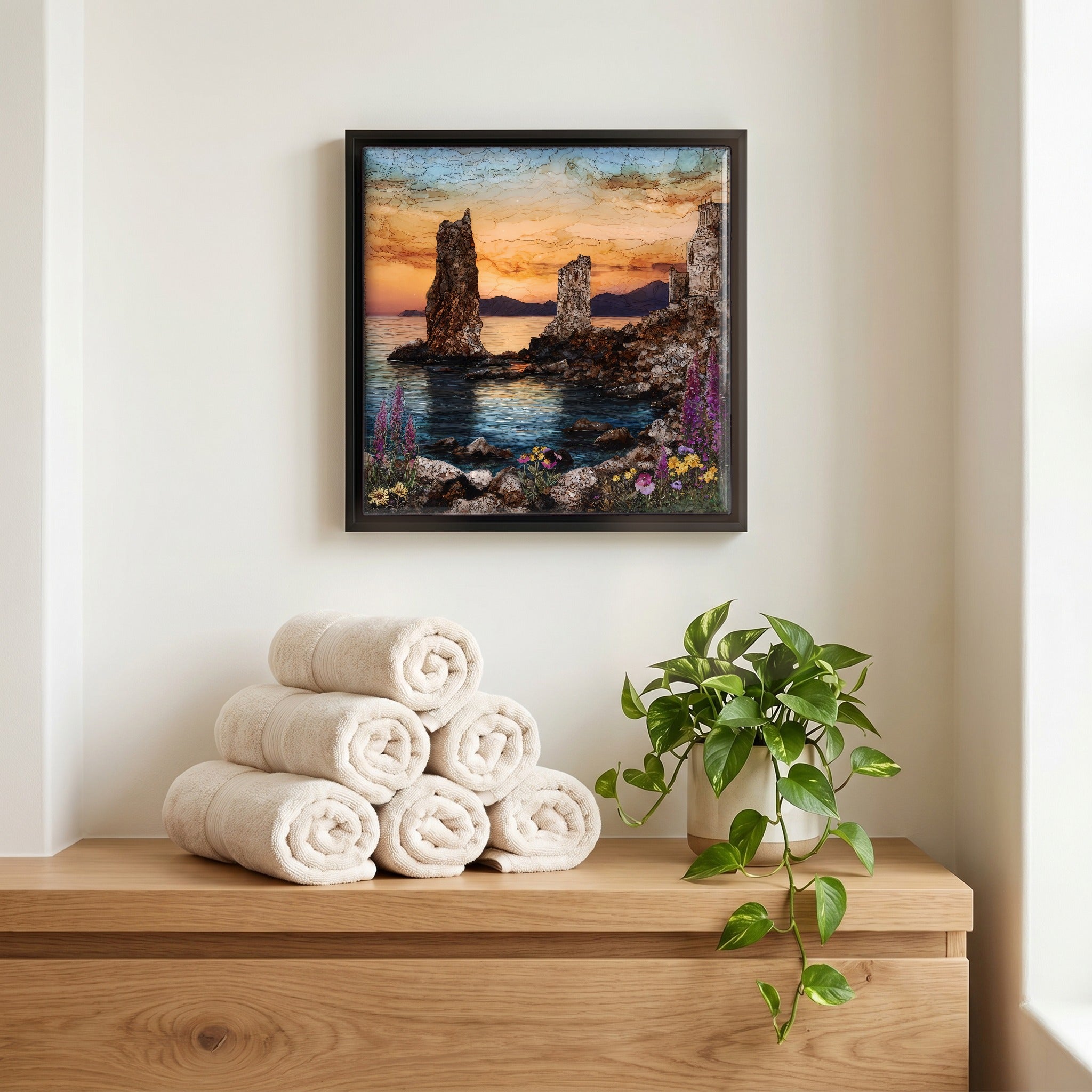 Above the linens, in a slim black surround.
