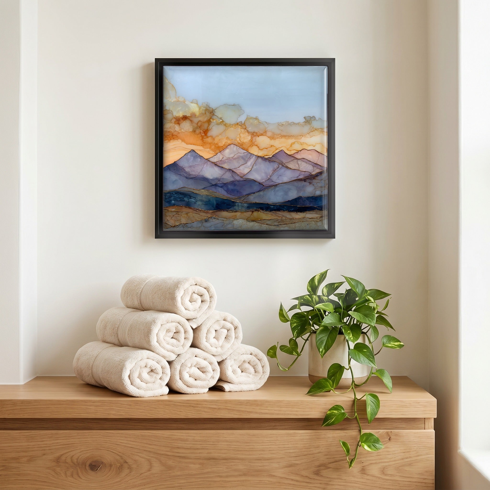 Above the linens, in a slim black surround.