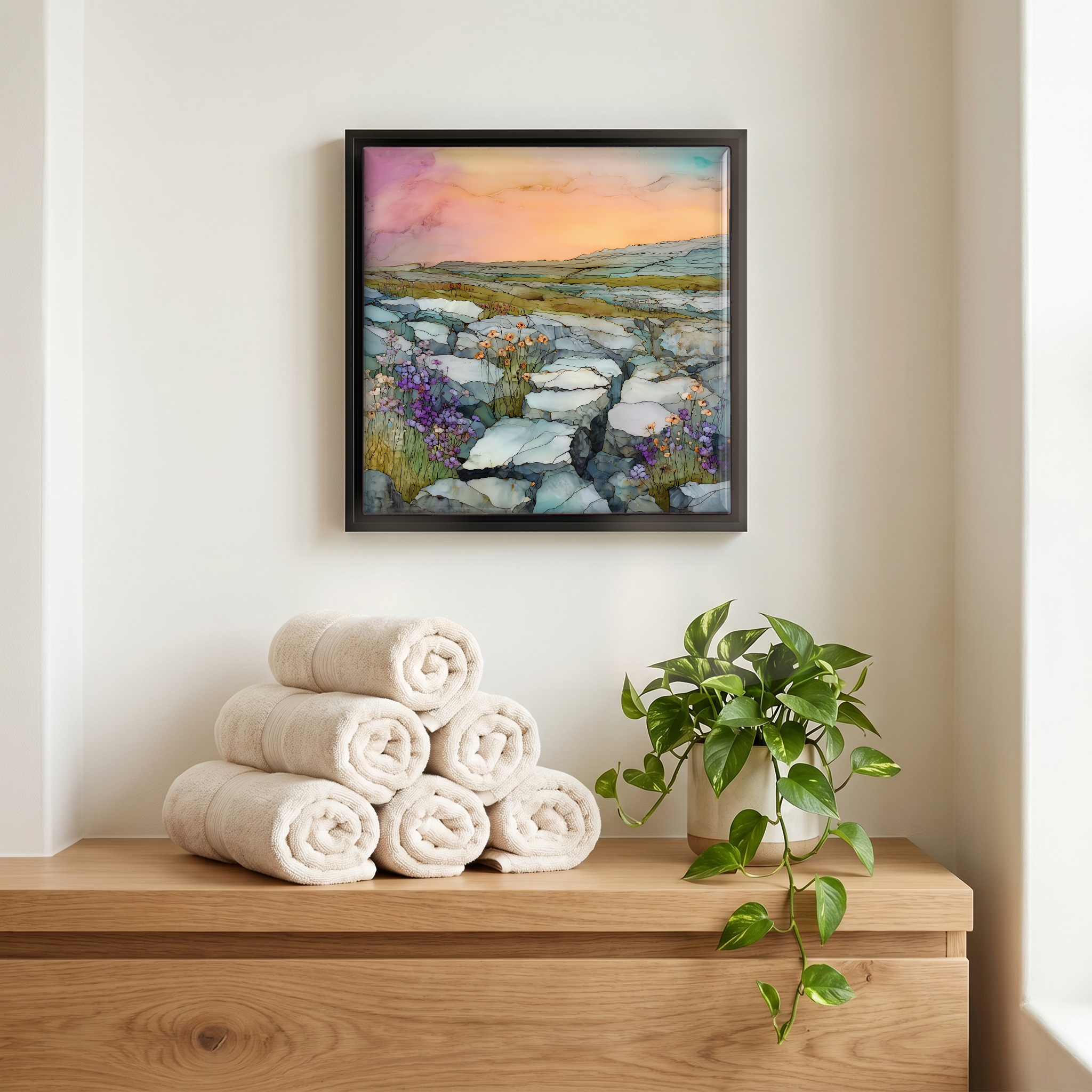 Above the linens, in a slim black surround.