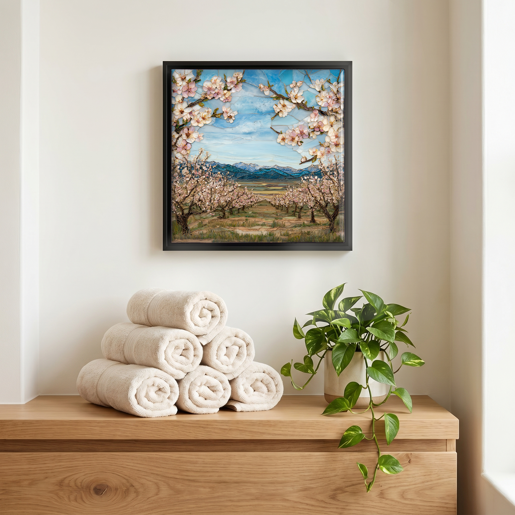 Above the linens, in a slim black surround.