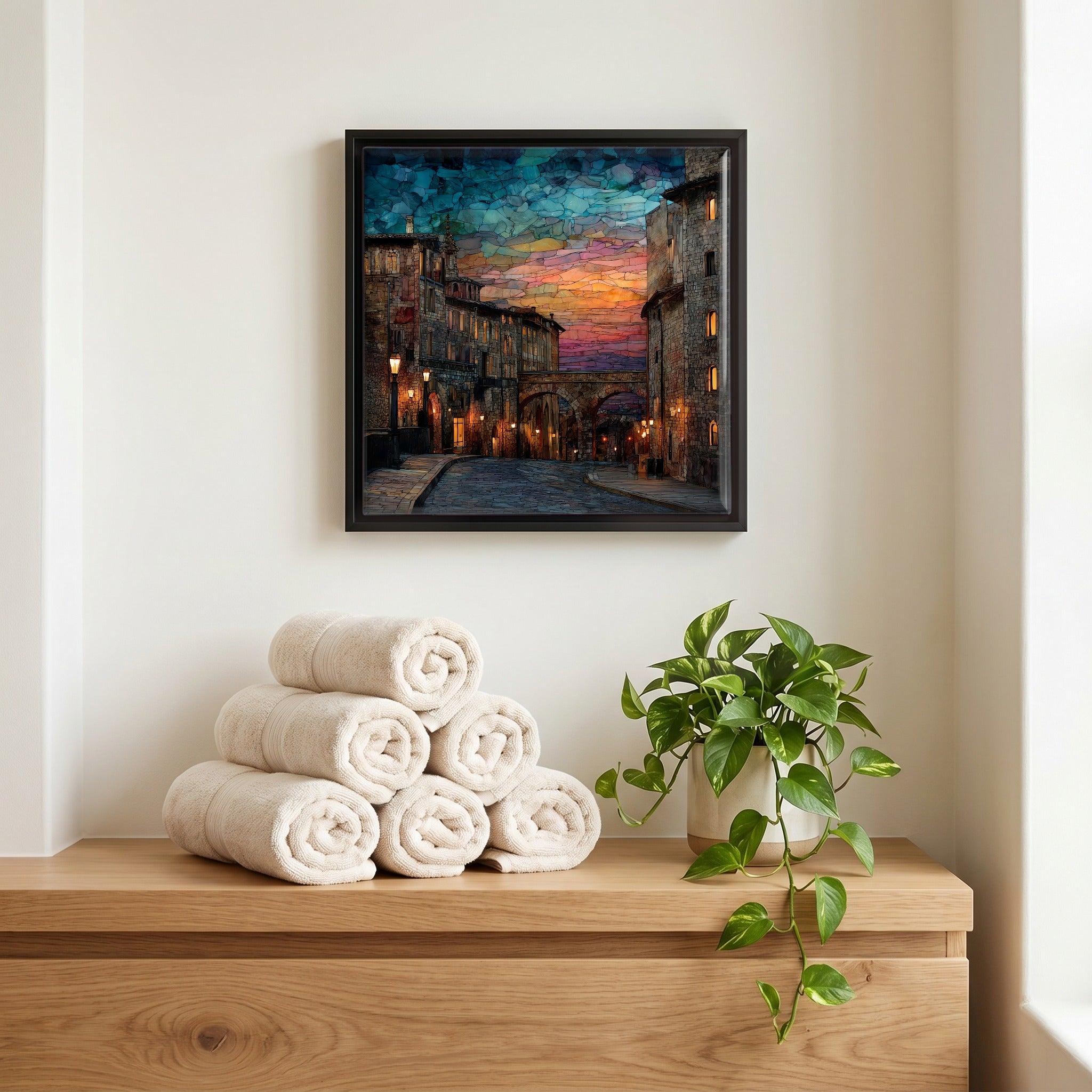 Above the linens, in a slim black surround.