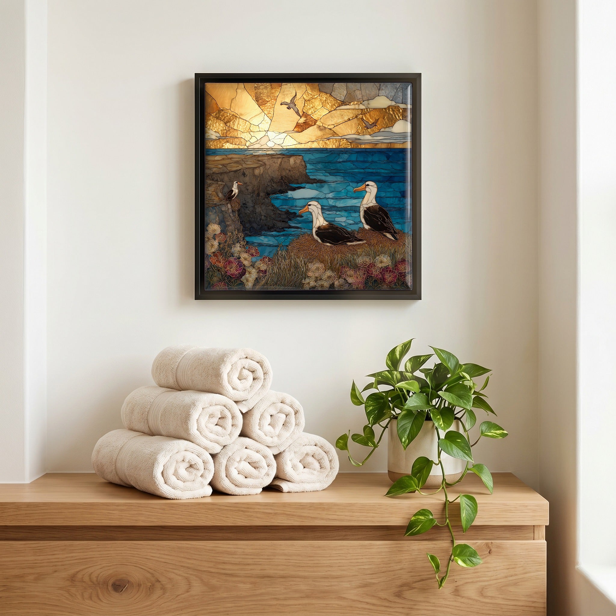 Above the linens, in a slim black surround.