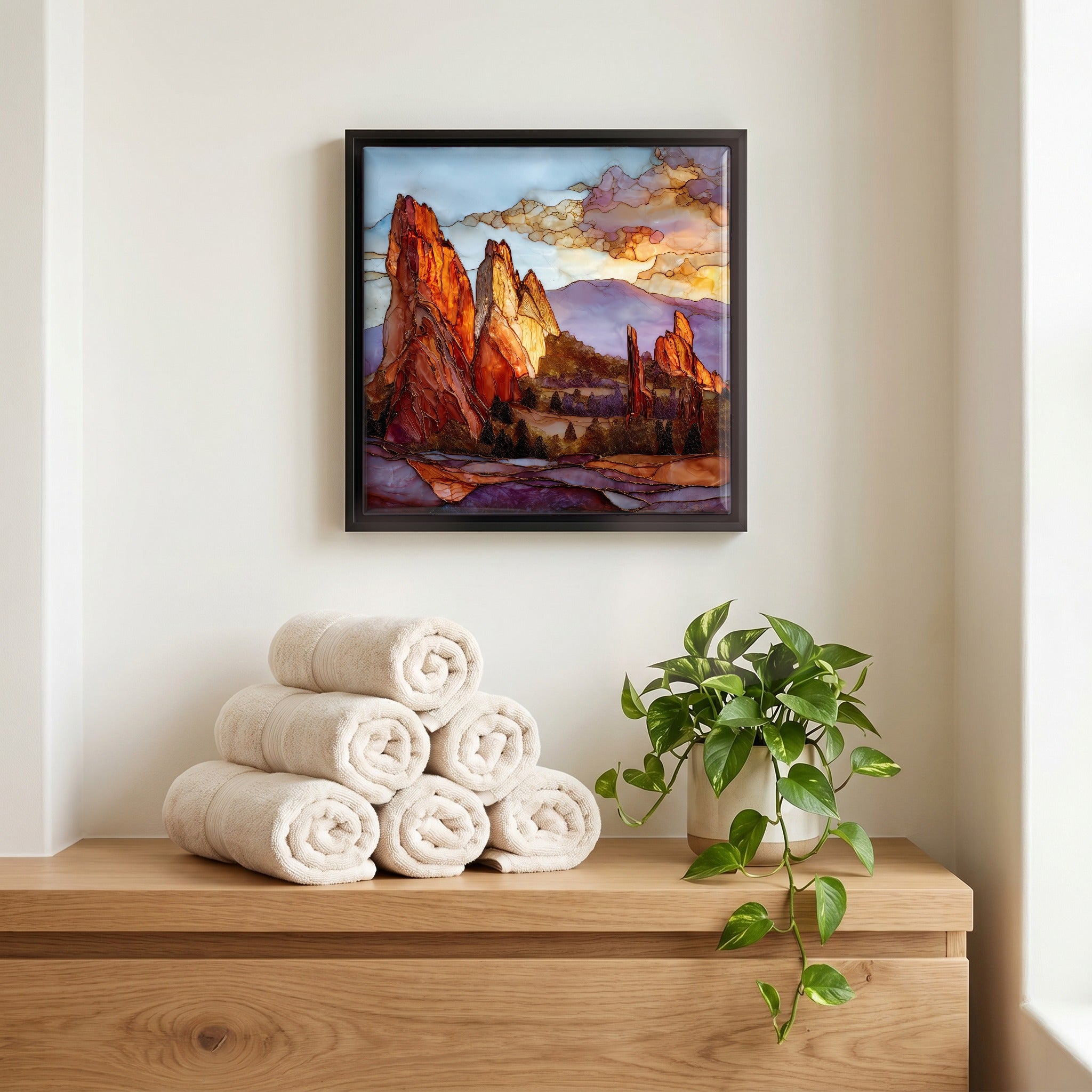 Above the linens, in a slim black surround.