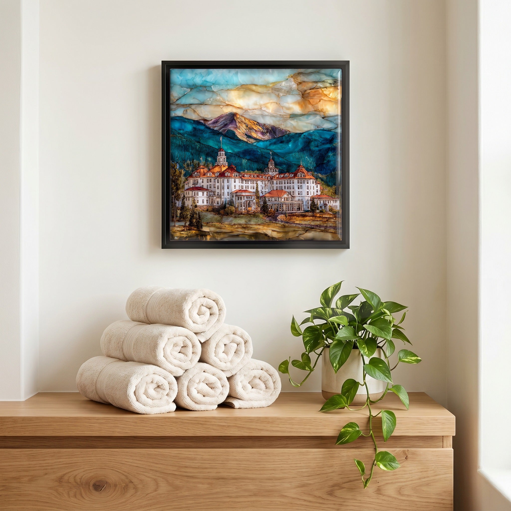 Above the linens, in a slim black surround.