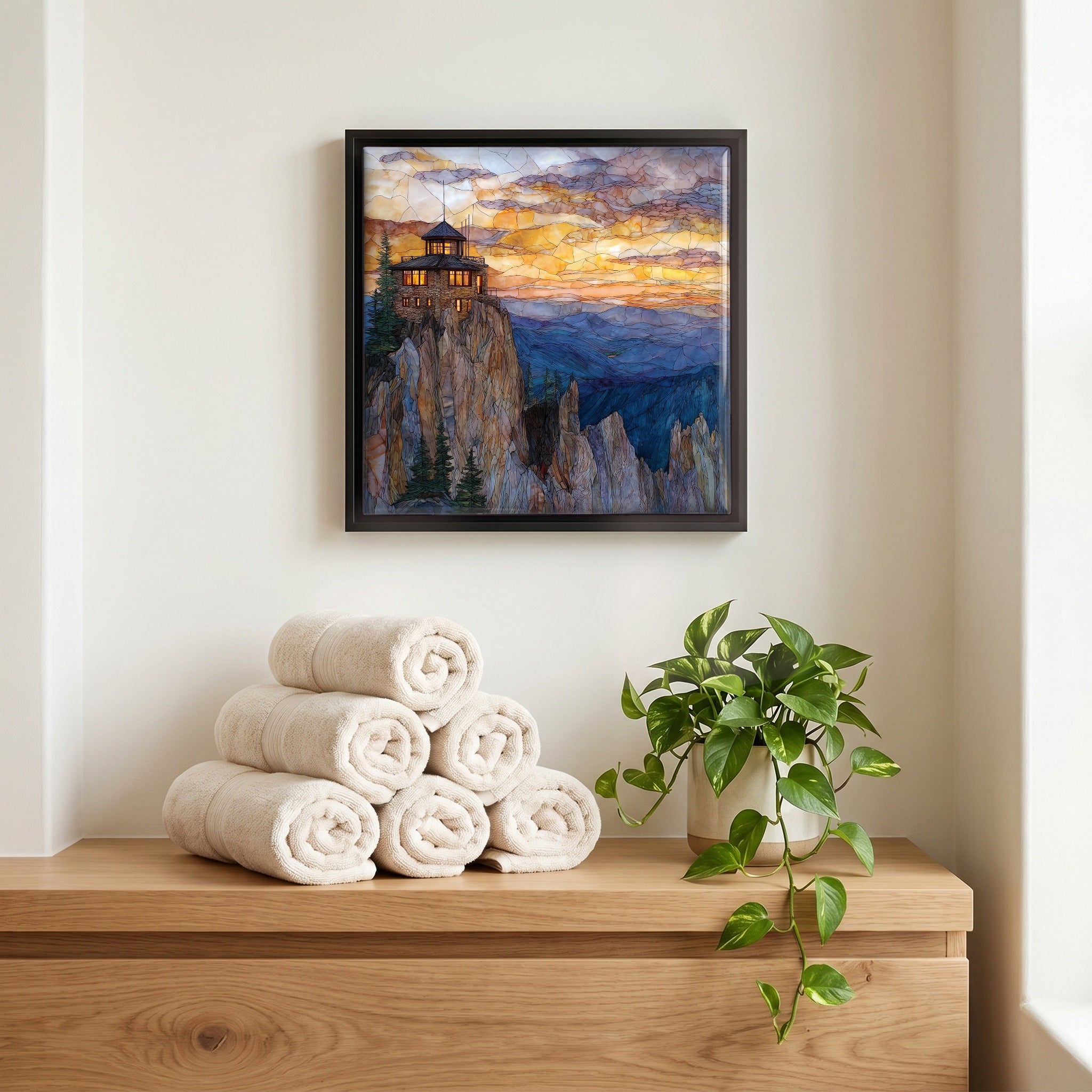 Above the linens, in a slim black surround.