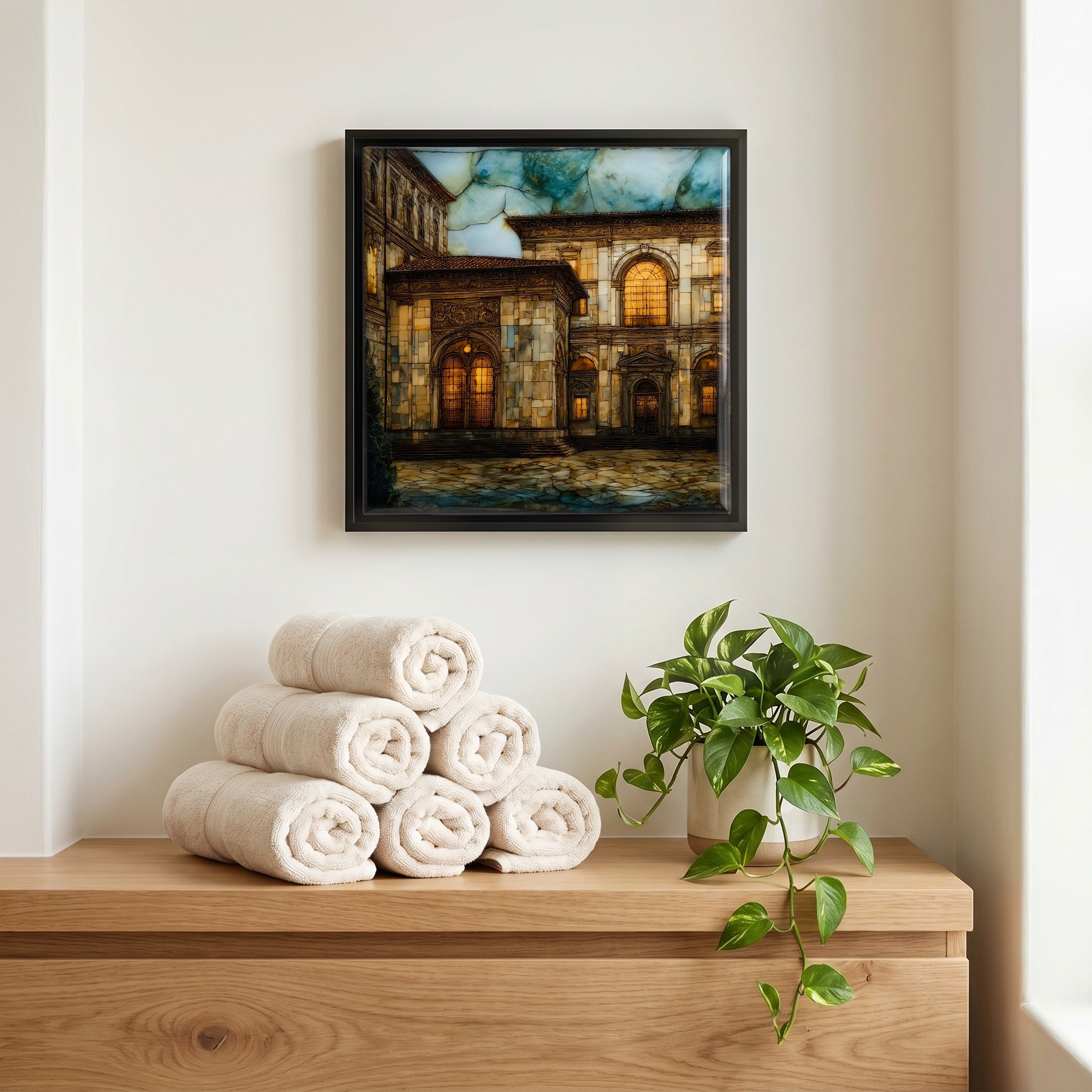 Above the linens, in a slim black surround.