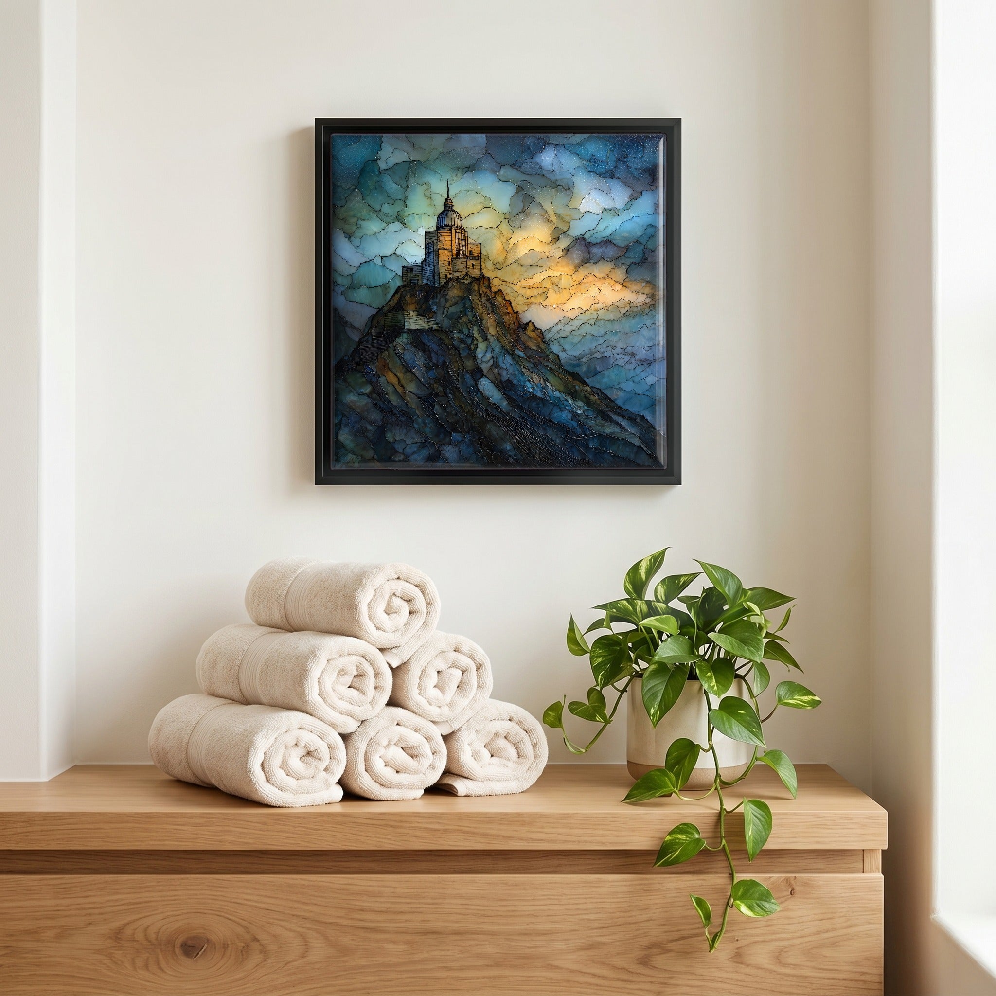 Above the linens, in a slim black surround.
