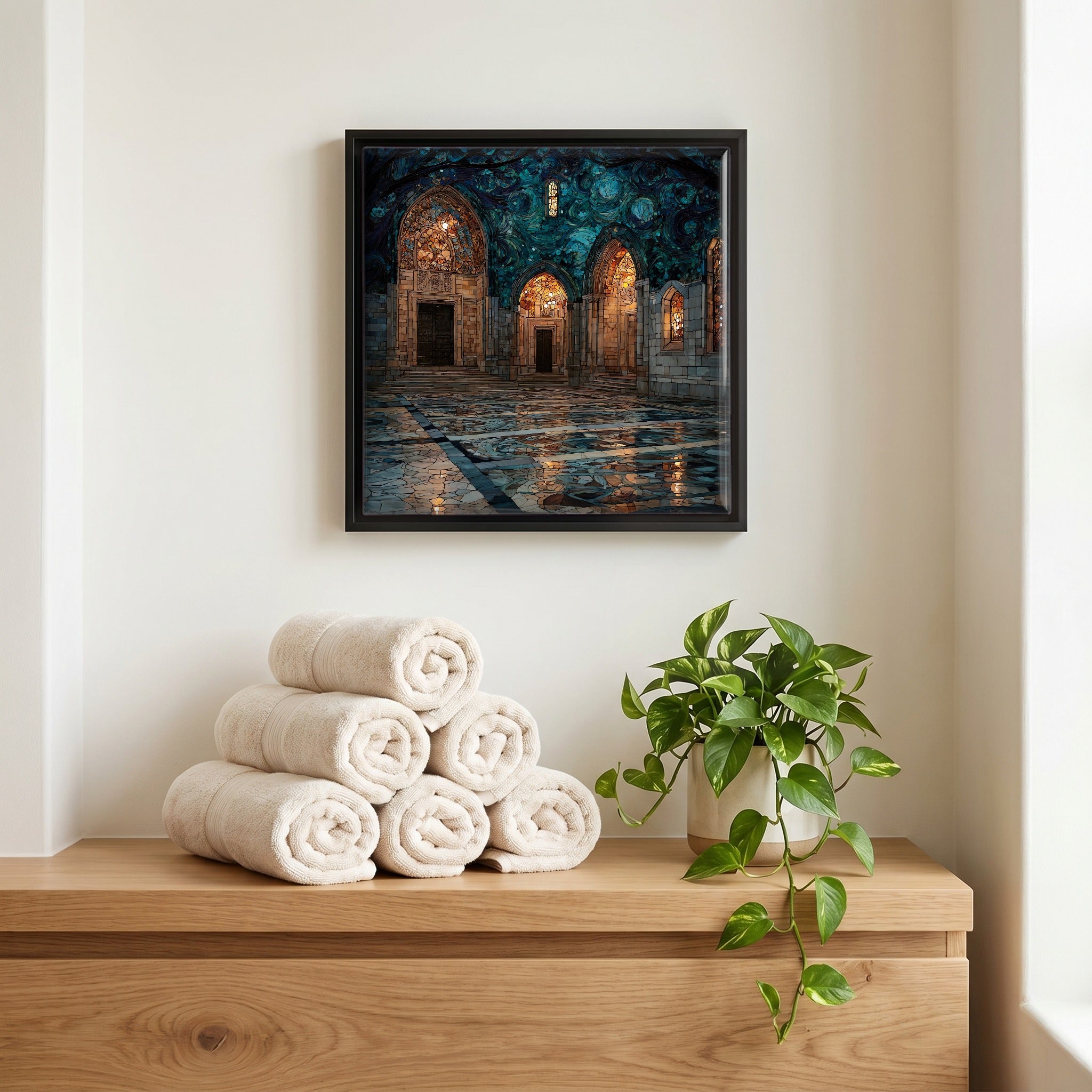 Above the linens, in a slim black surround.