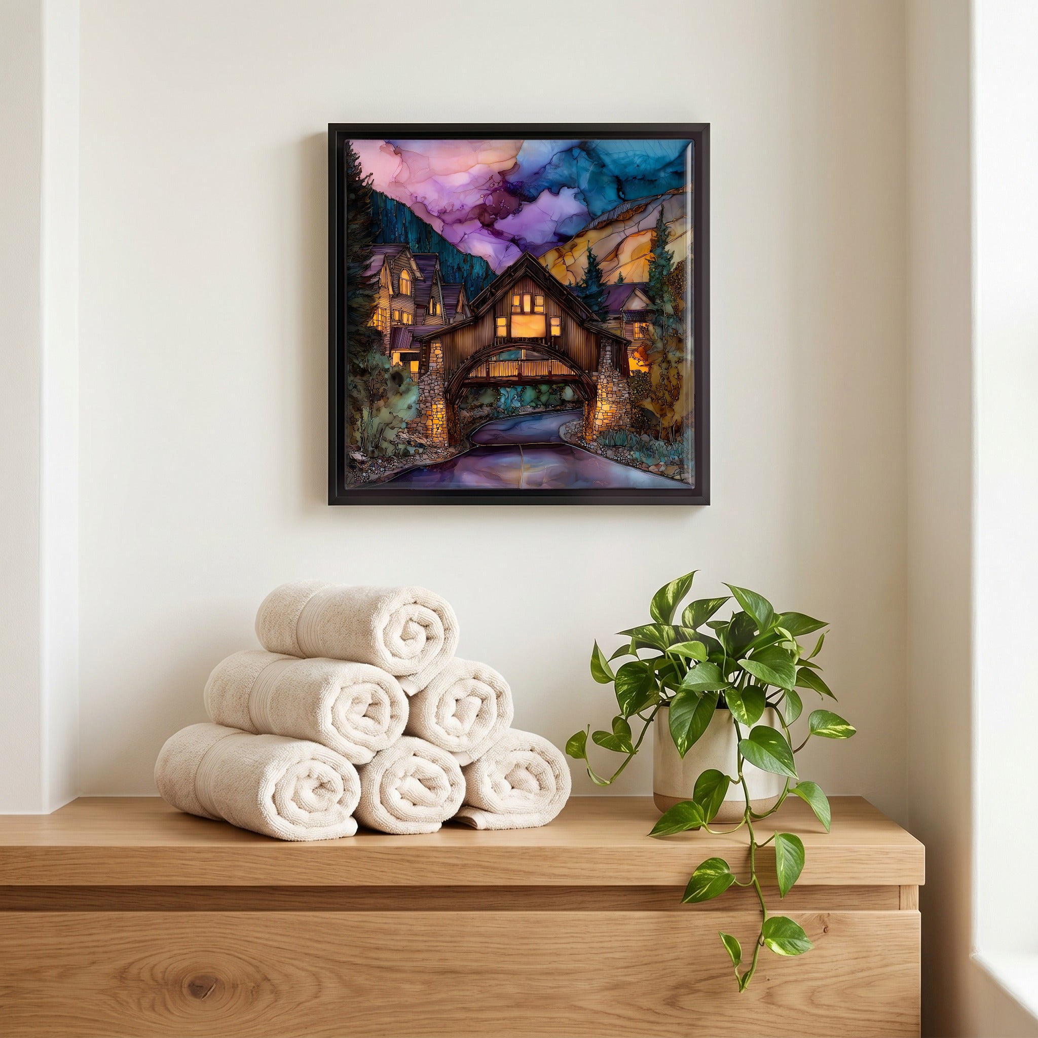 Above the linens, in a slim black surround.