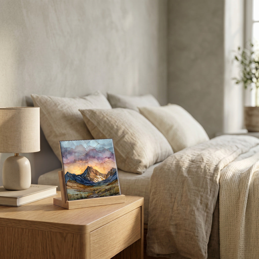 On the nightstand, on a light oak stand.