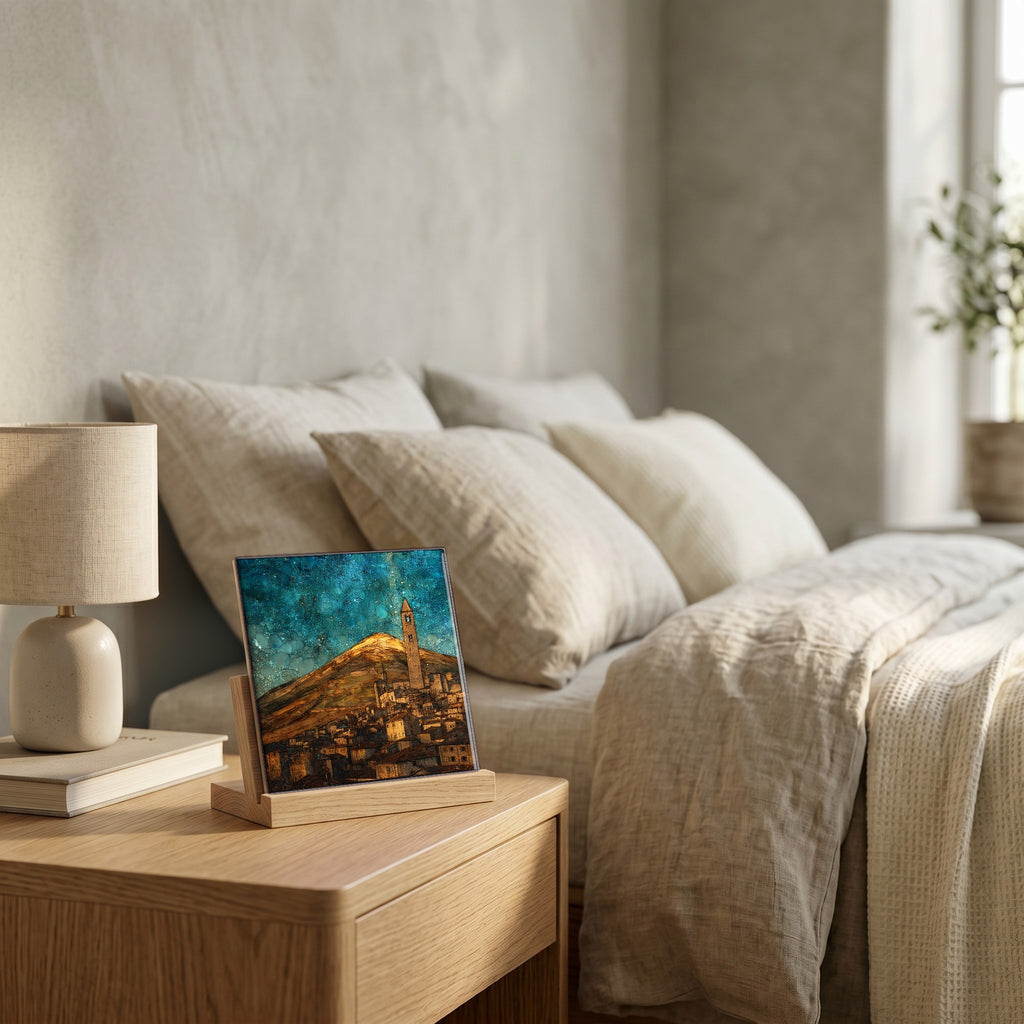On the nightstand, on a light oak stand.