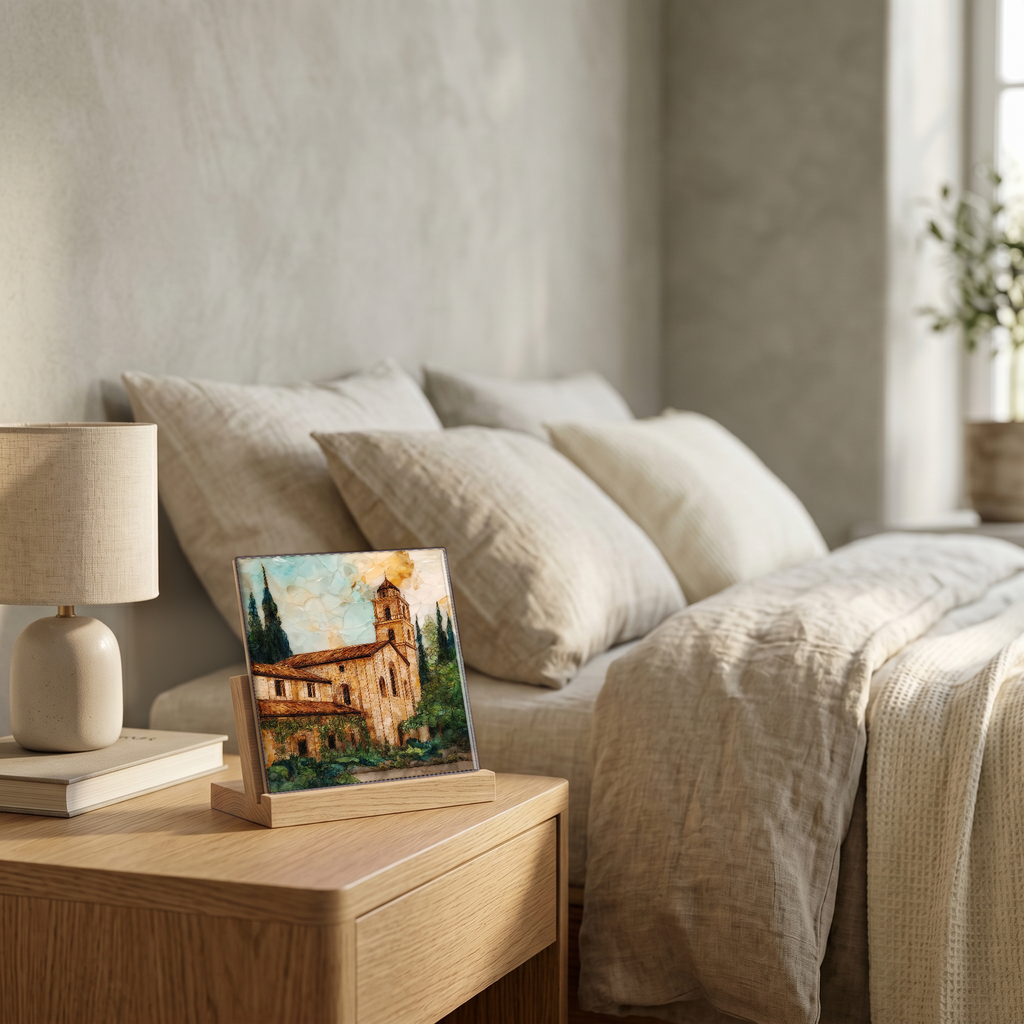 On the nightstand, on a light oak stand.