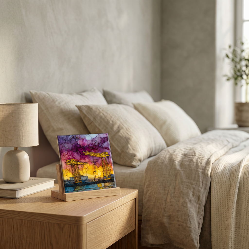 On the nightstand, on a light oak stand.