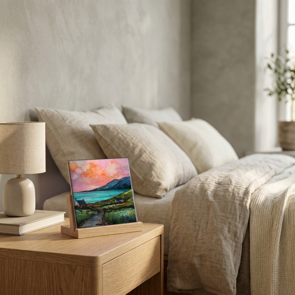 On the nightstand, on a light oak stand.