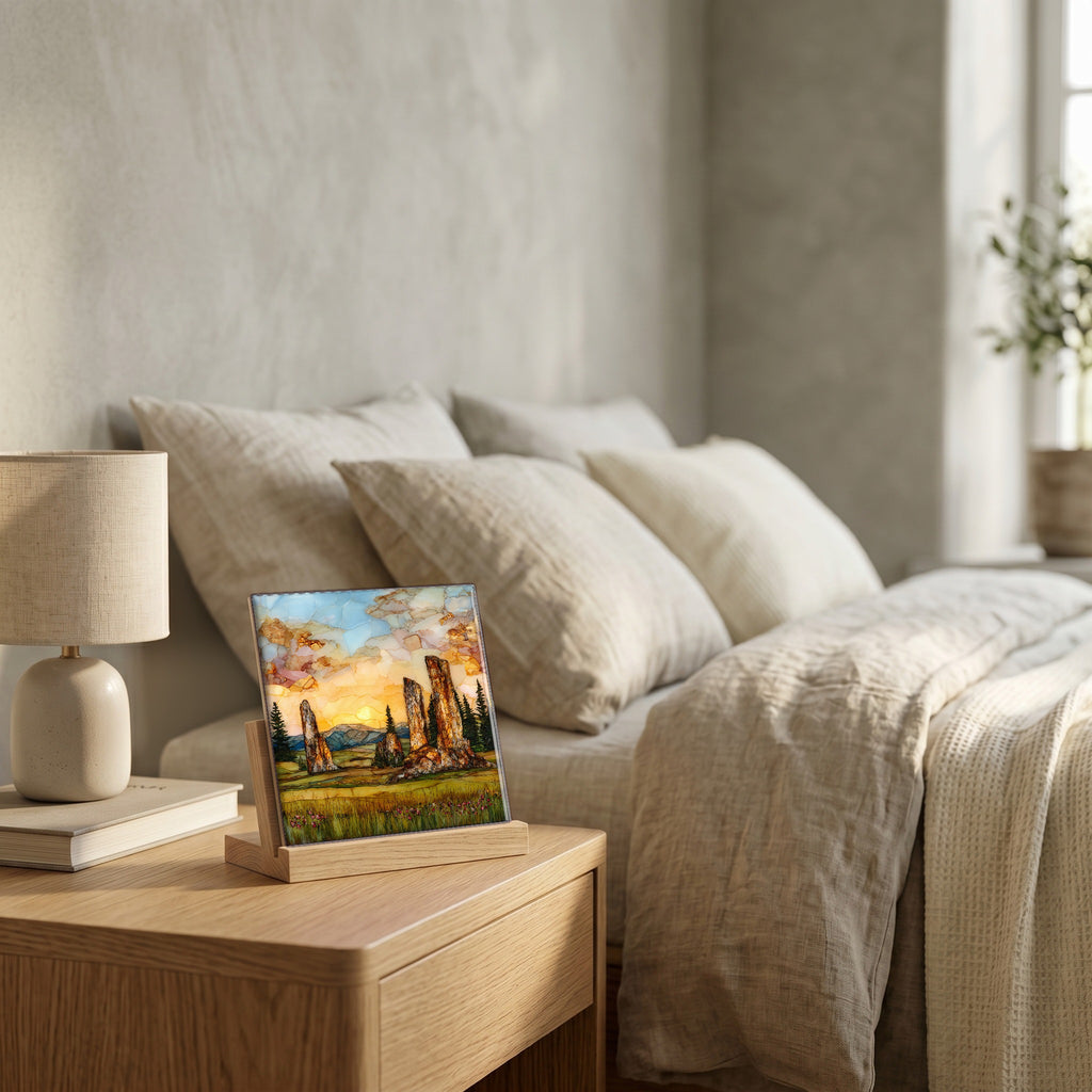 On the nightstand, on a light oak stand.