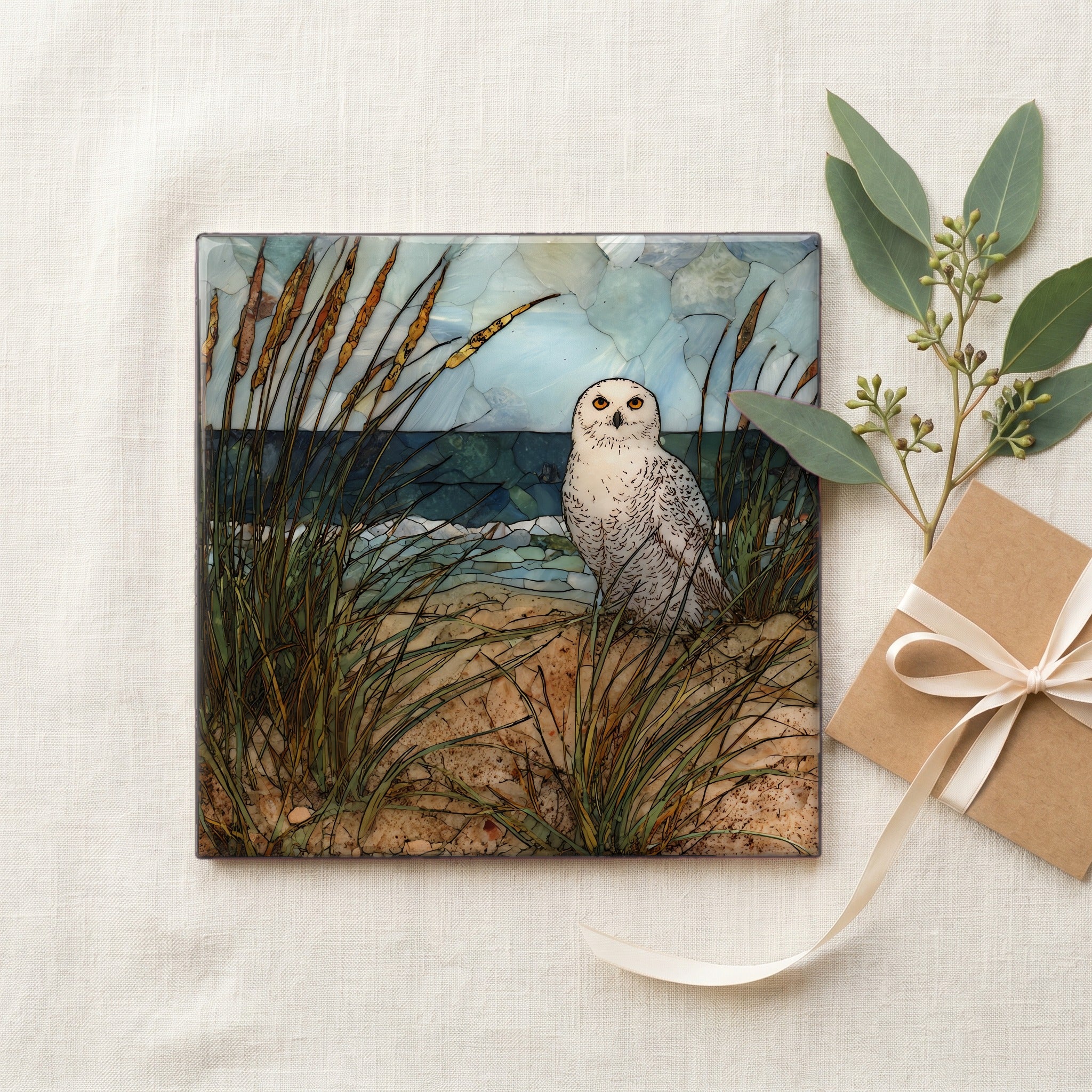 a snowy owl on a wind-shaped — gifting